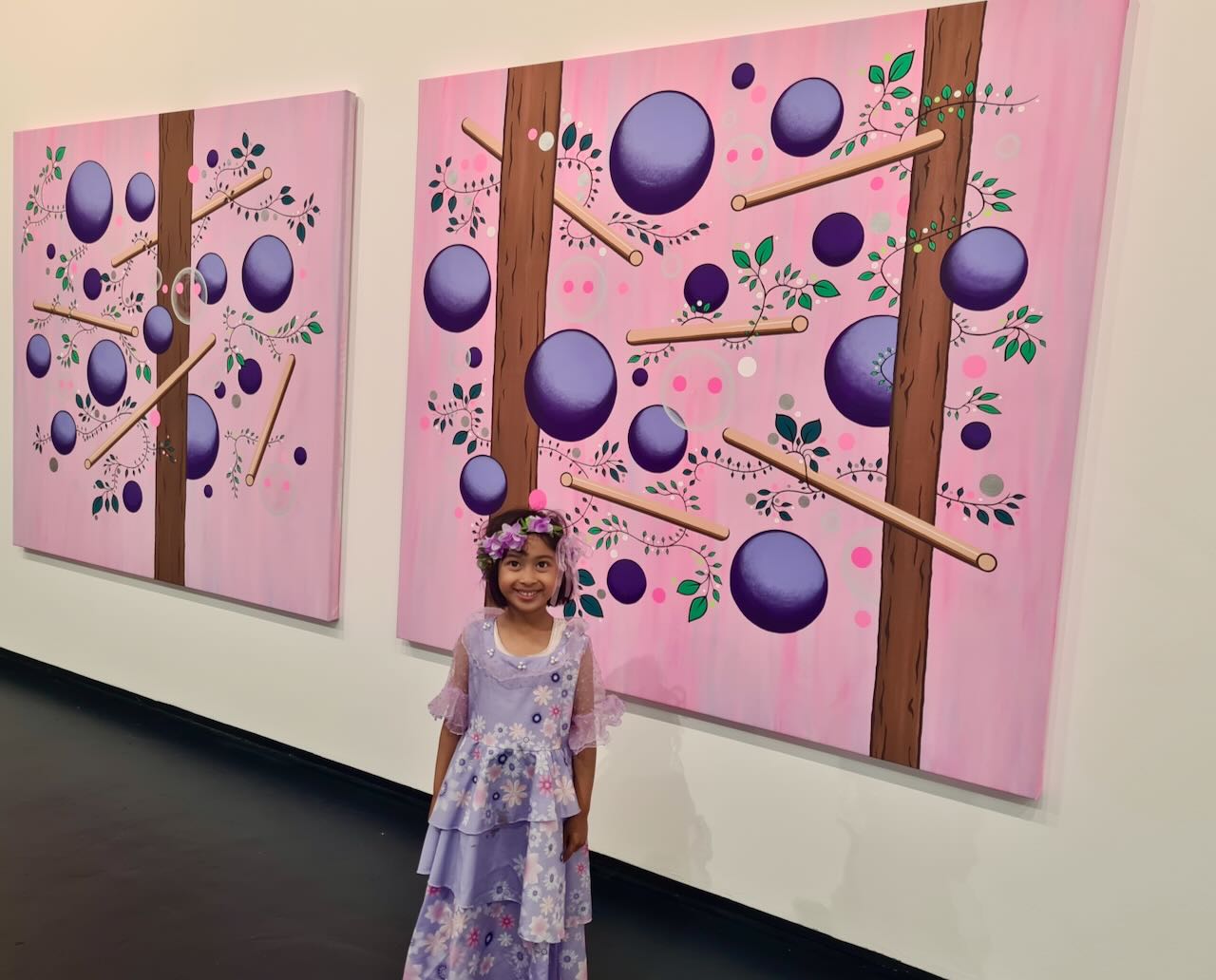 Patty in front of painting part of the Sour Grapes exhibit at City Gallery Wellington