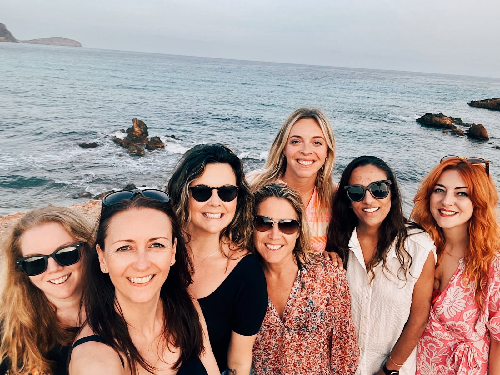 Women from Ibiza Reconnection Retreat enjoy a beach day