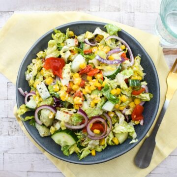 A dressed Vegan Grinder Salad with corn