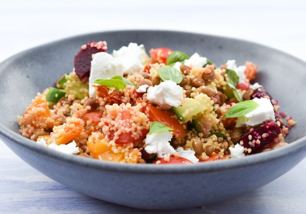 vegan couscous salad with lentils and feta cheese.