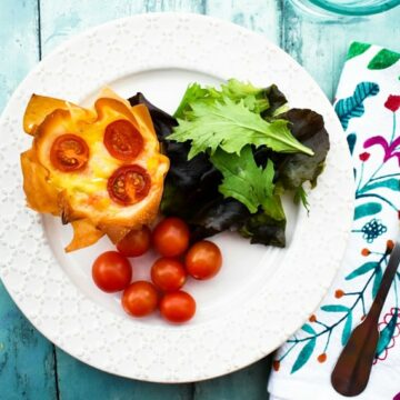 Vegan Cheese Red Pepper Filo Hand Pie with salad leaves and cherry tomatoes